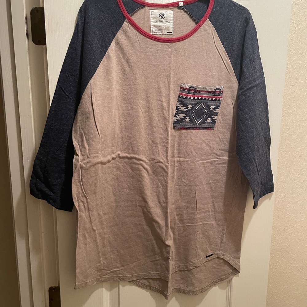 On the Byas Tan and Navy Raglan Tee